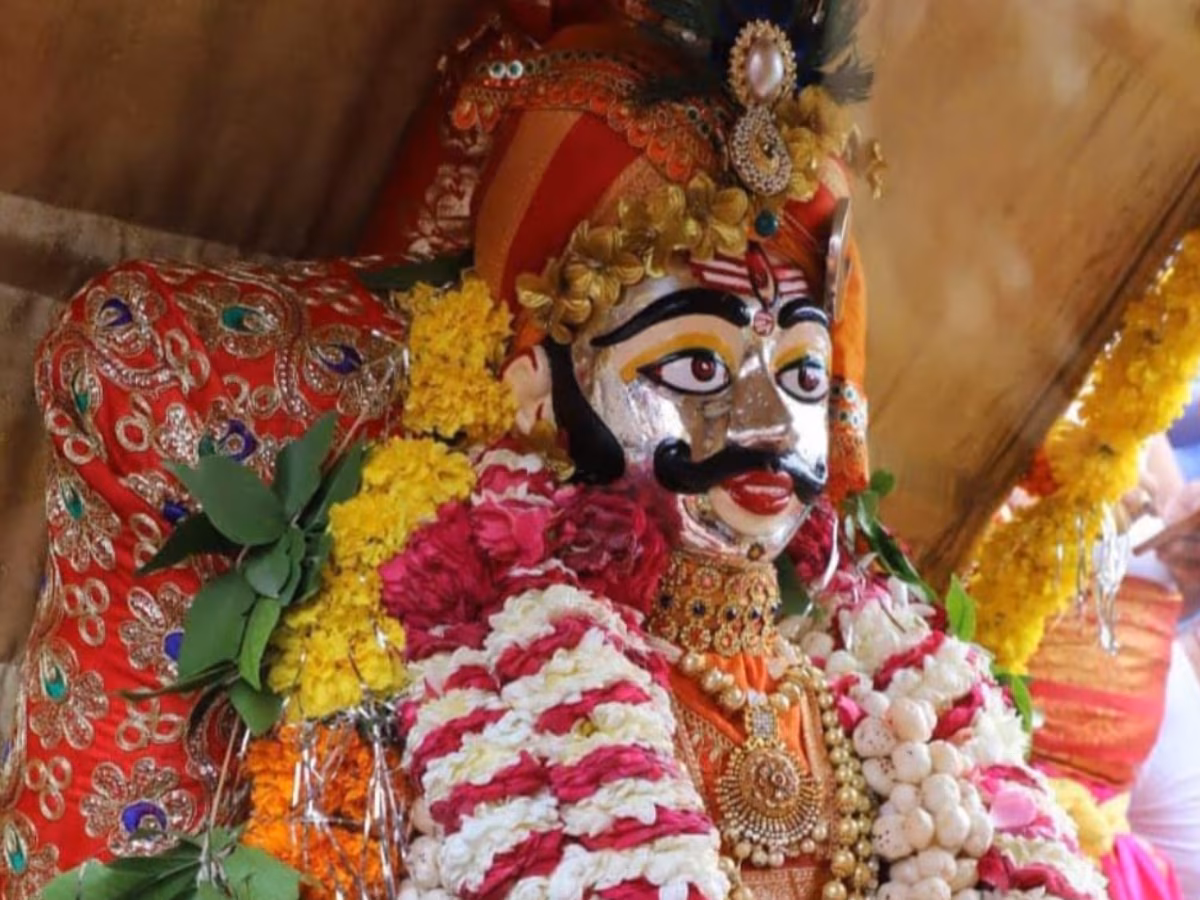 Decorated Khatu Shyam Ji idol adorned with vibrant garlands and traditional attire during Indian religious festival celebration